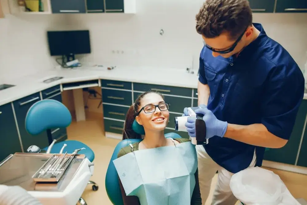 A teenage patient smiling after her visit