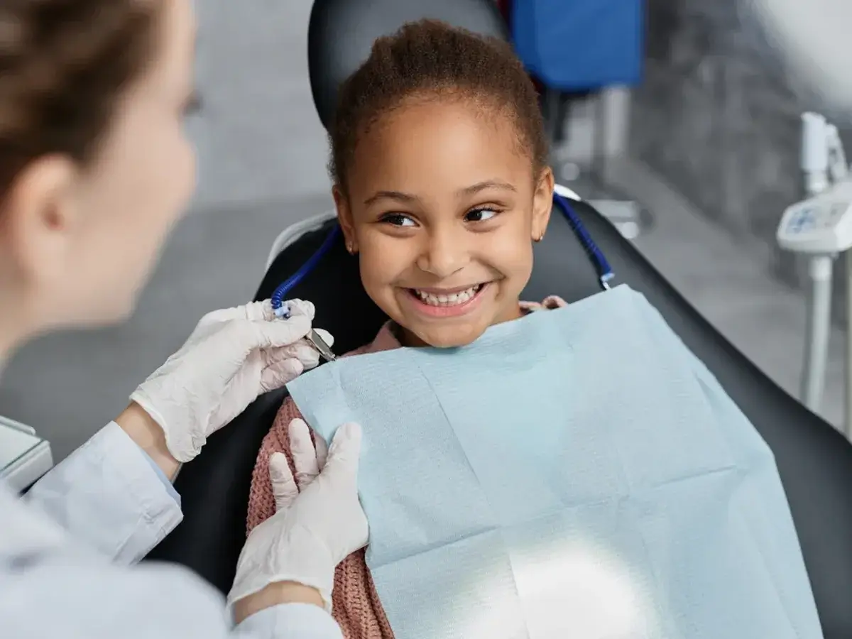 A young patient smiling during a visit