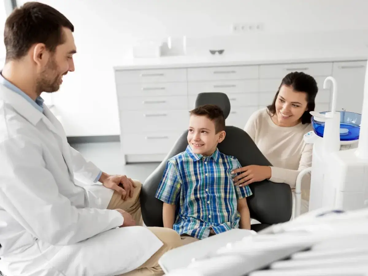 A young patient smiling during a visit