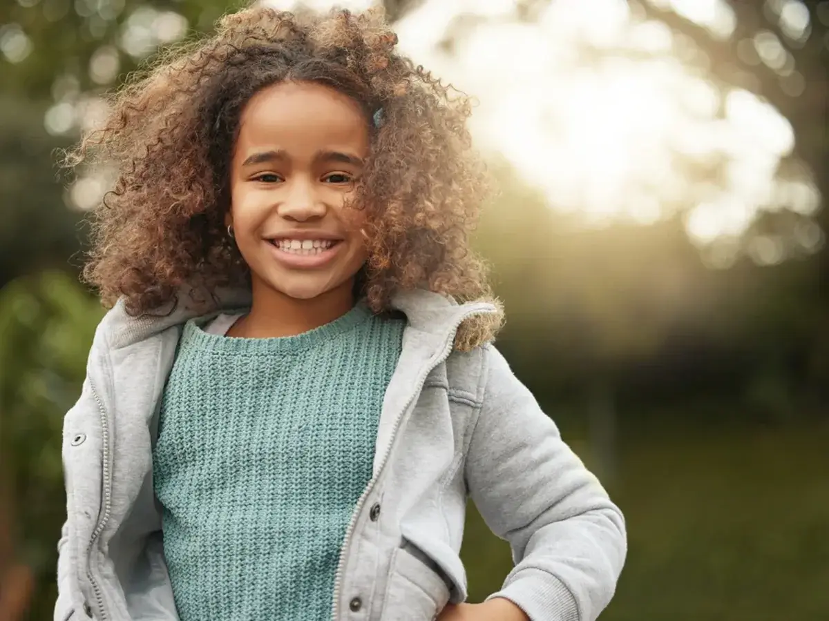 A young patient smiling during a visit