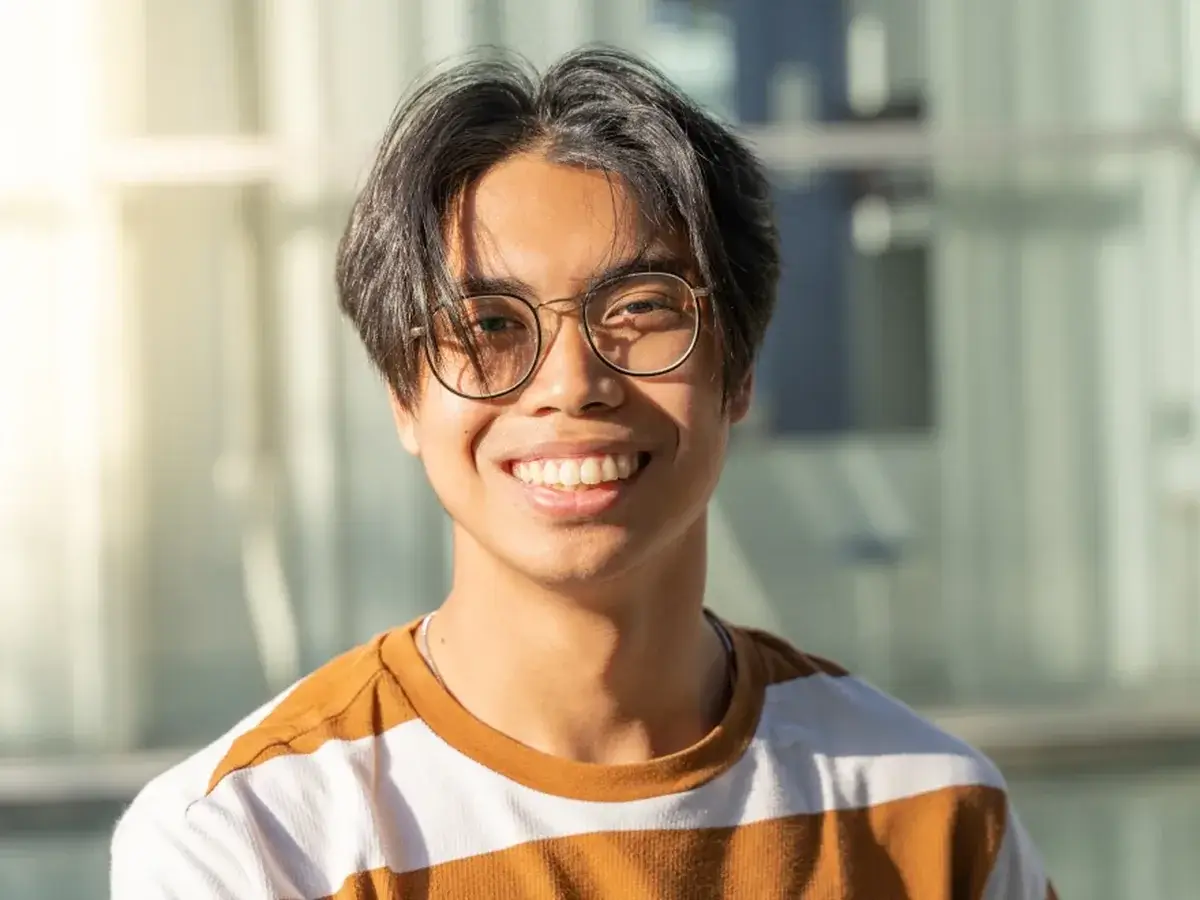 A teenage patient smiling during a visit