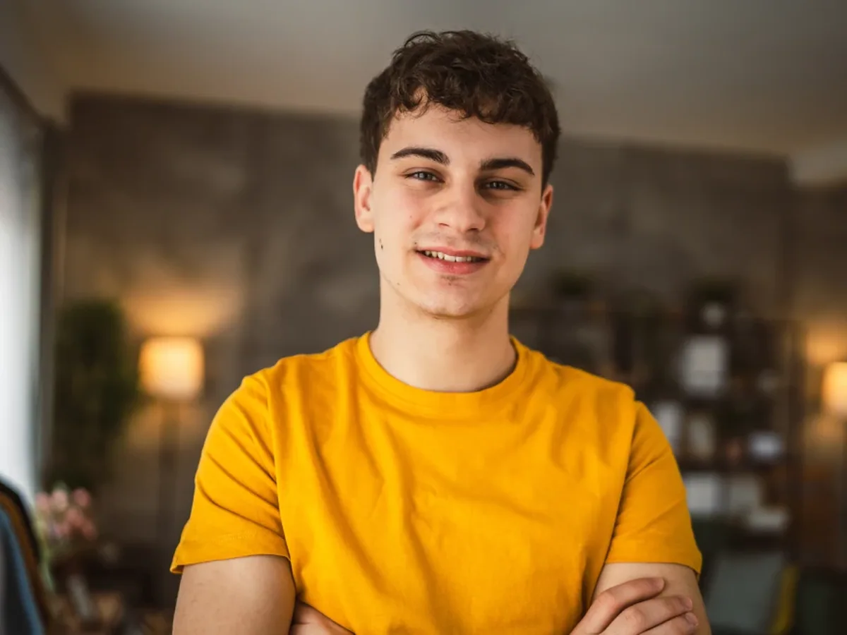 A teenage patient smiling during a visit