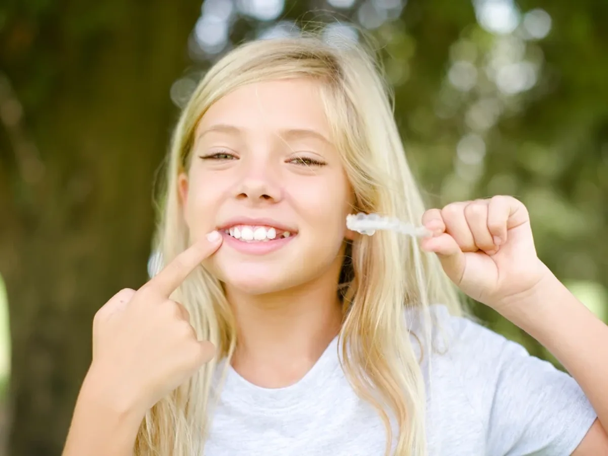 A teenage patient smiling during a visit