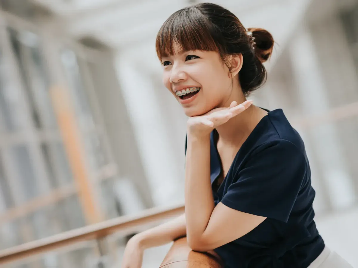 A teenage patient with braces smiling