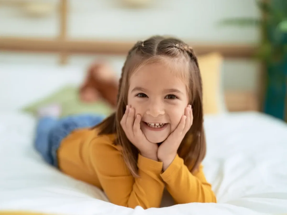 A young patient smiling during a visit