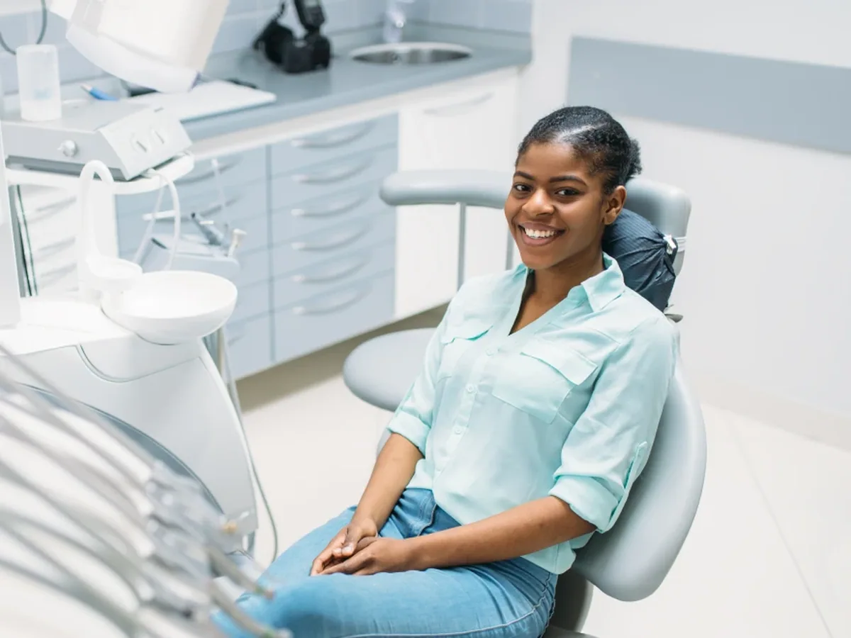 A teenage patient smiling during a visit