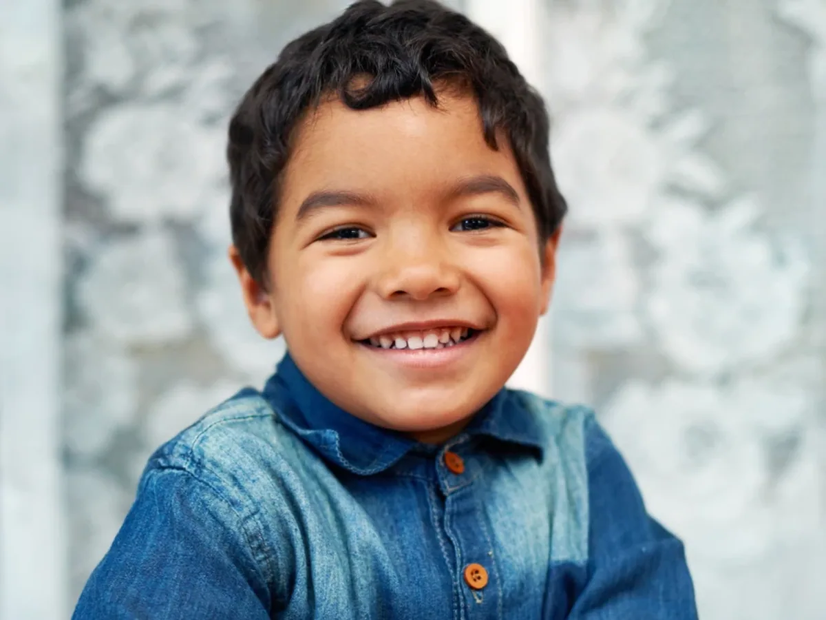 A young patient smiling during a visit