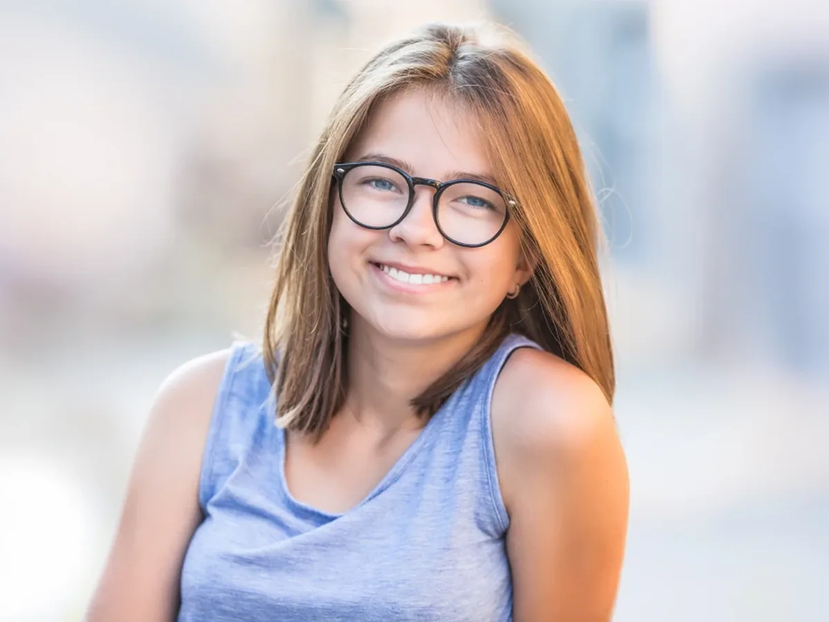 A teenage patient smiling during a visit