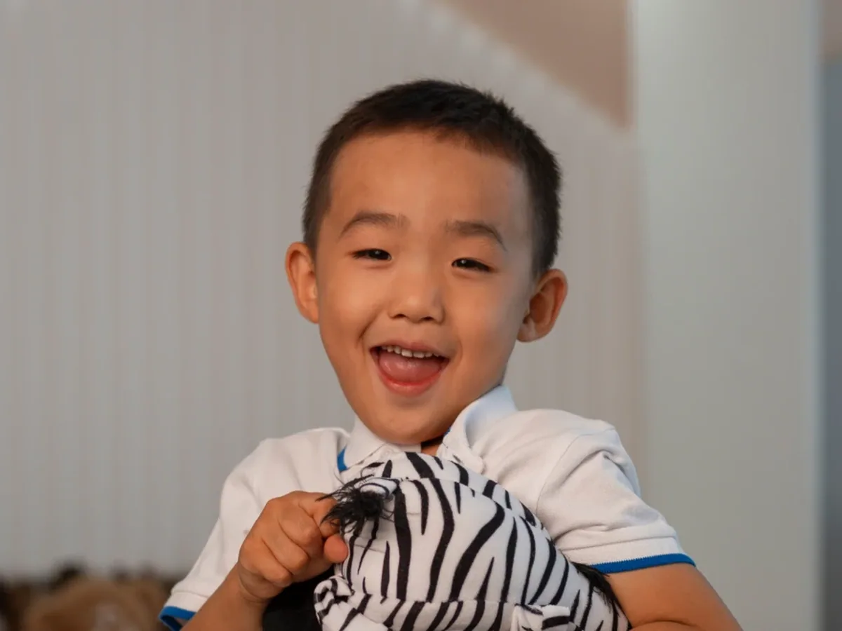 A young patient smiling during a visit