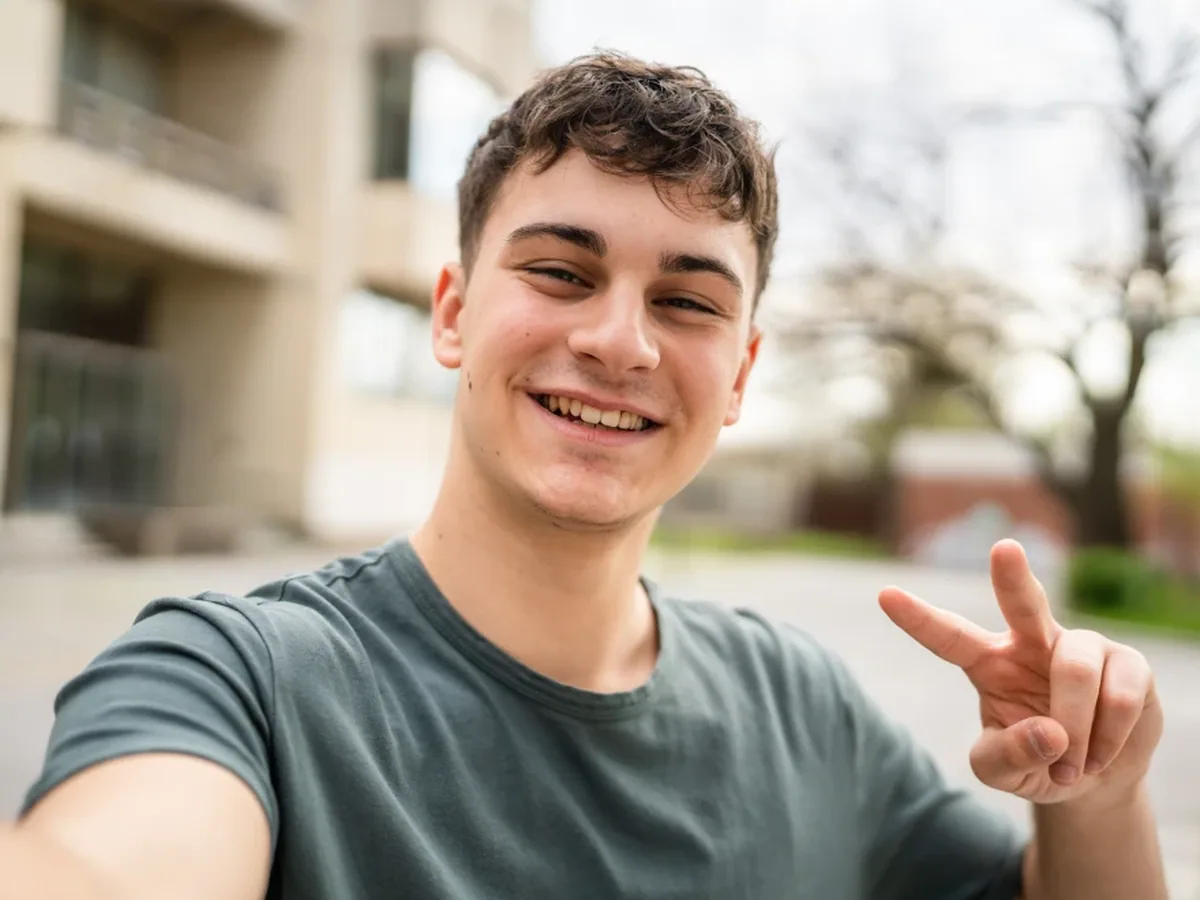 A teenage patient smiling during a visit
