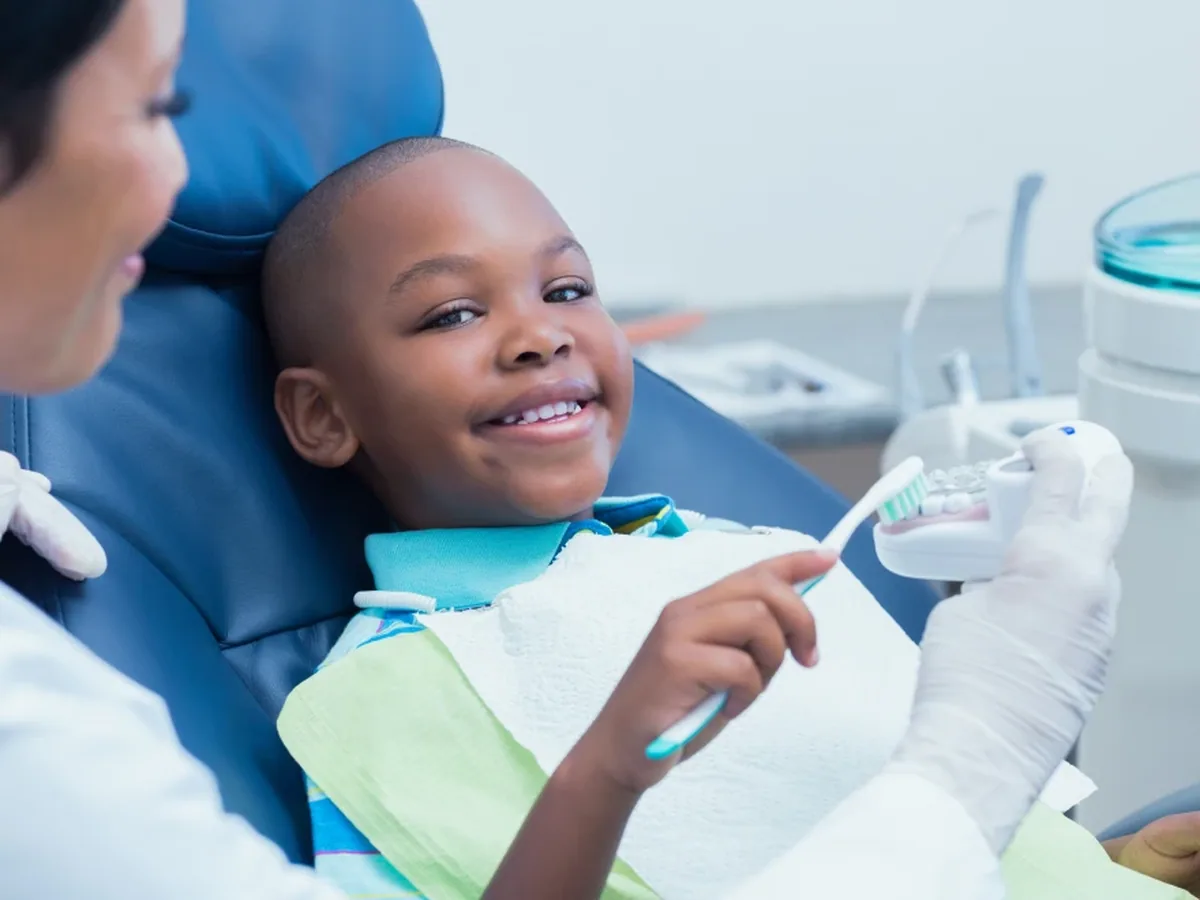A young patient smiling during a visit