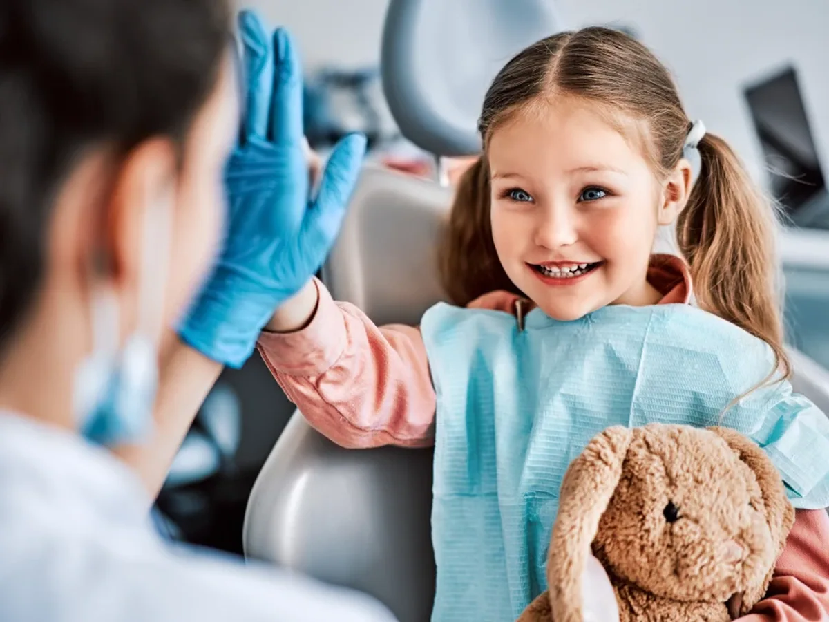 A young patient smiling during a visit