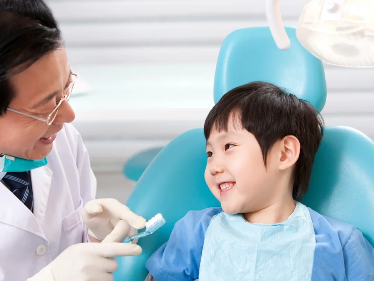 A young patient smiling during a visit