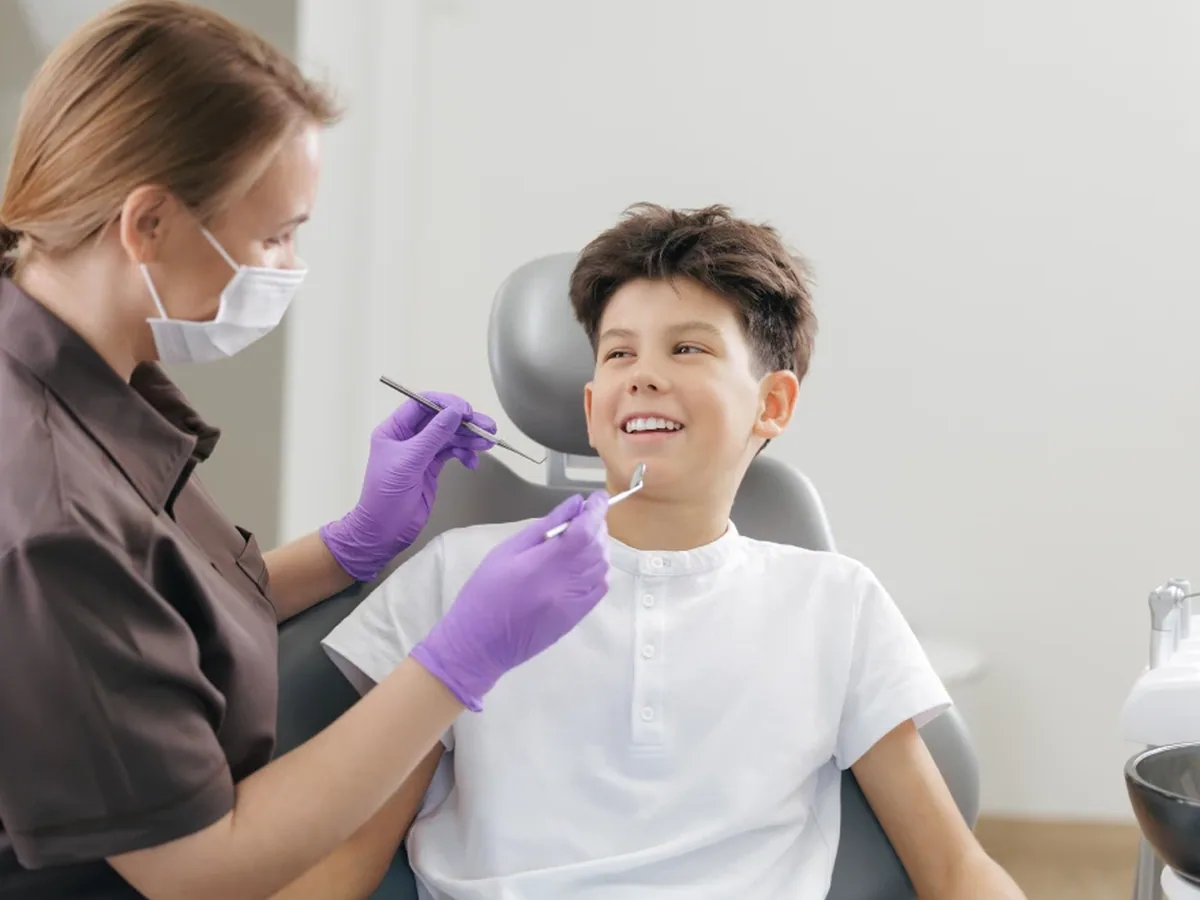 A teenage patient smiling during a visit