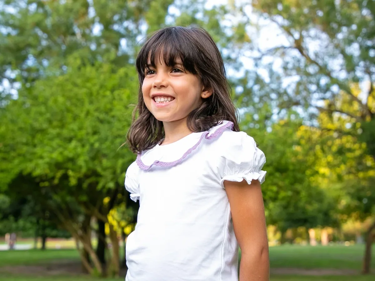 A young patient smiling during a visit