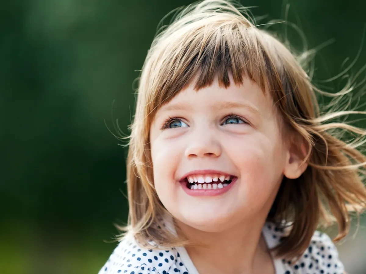 A young patient smiling during a visit